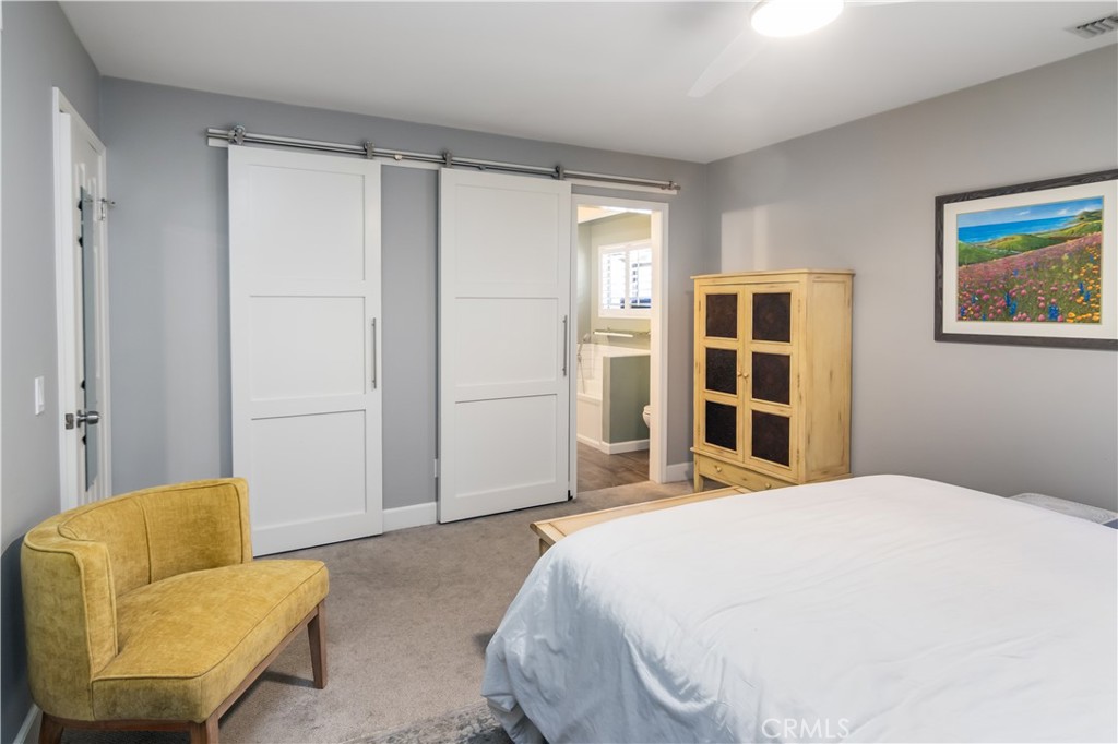 24831 Apple Street, Unit B Newhall, CA 91321 - Photo 19 of 37 a bedroom with a bed and a couch