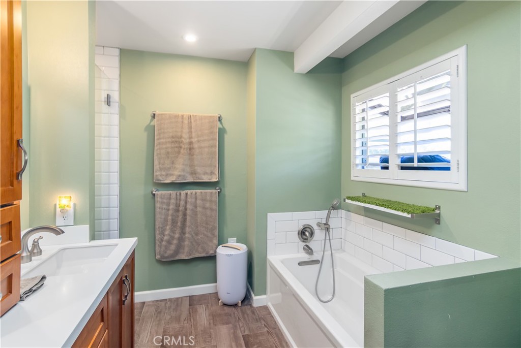 24831 Apple Street, Unit B Newhall, CA 91321 - Photo 20 of 37 a bathroom with a sink and a mirror