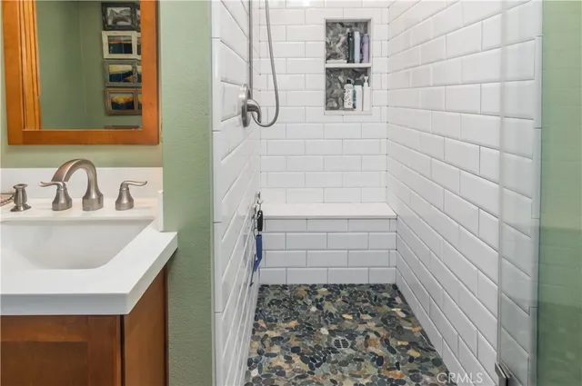 a bathroom with a sink and a shower