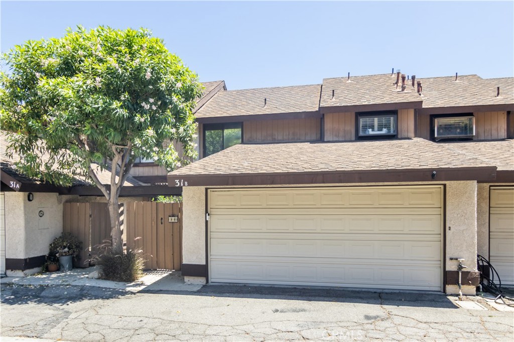 24831 Apple Street, Unit B Newhall, CA 91321 - Photo 28 of 37 a view of a house with a door