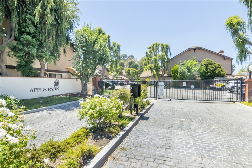24831 Apple Street, Unit B Newhall, CA 91321 - Photo 29 of 37 a view of a street with a bench in front of it