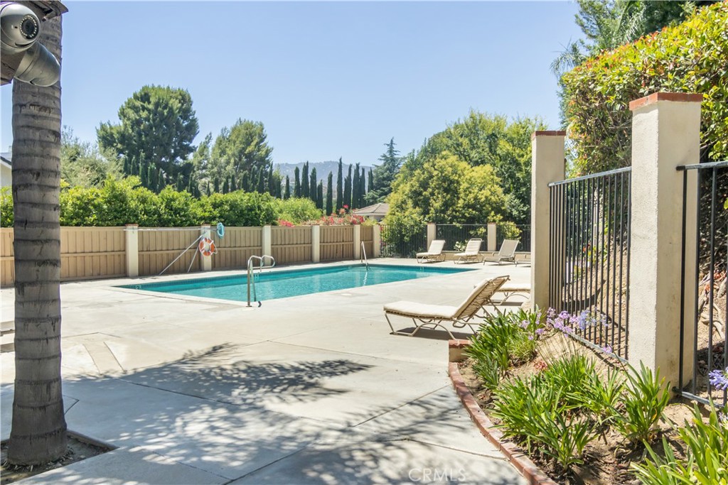 24831 Apple Street, Unit B Newhall, CA 91321 - Photo 30 of 37 a view of a park with iron fence