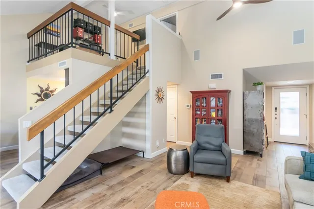 a view of entryway livingroom and hall with wooden floor