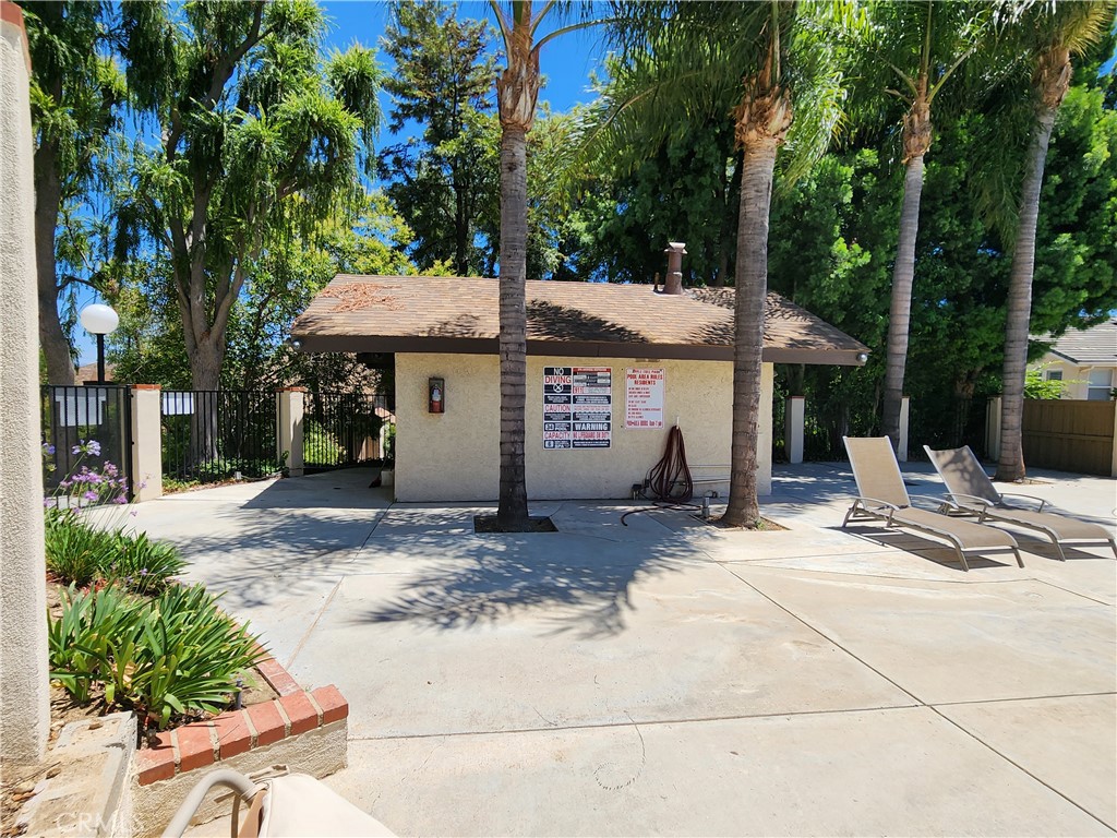 24831 Apple Street, Unit B Newhall, CA 91321 - Photo 33 of 37 a view of a house with backyard and sitting area
