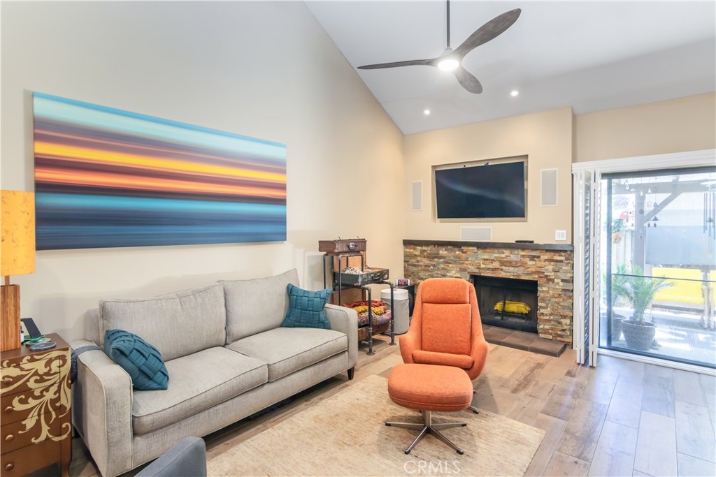 24831 Apple Street, Unit B Newhall, CA 91321 - Photo 7 of 37 a living room with furniture and a fireplace
