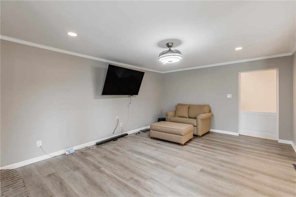 434 Rawley Road Americus, GA 31719 - Photo 28 of 50 a living room with furniture and a flat screen tv