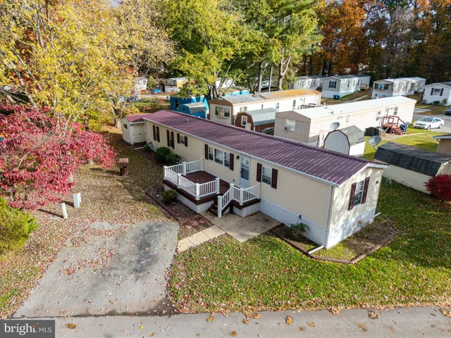 a view of house with backyard