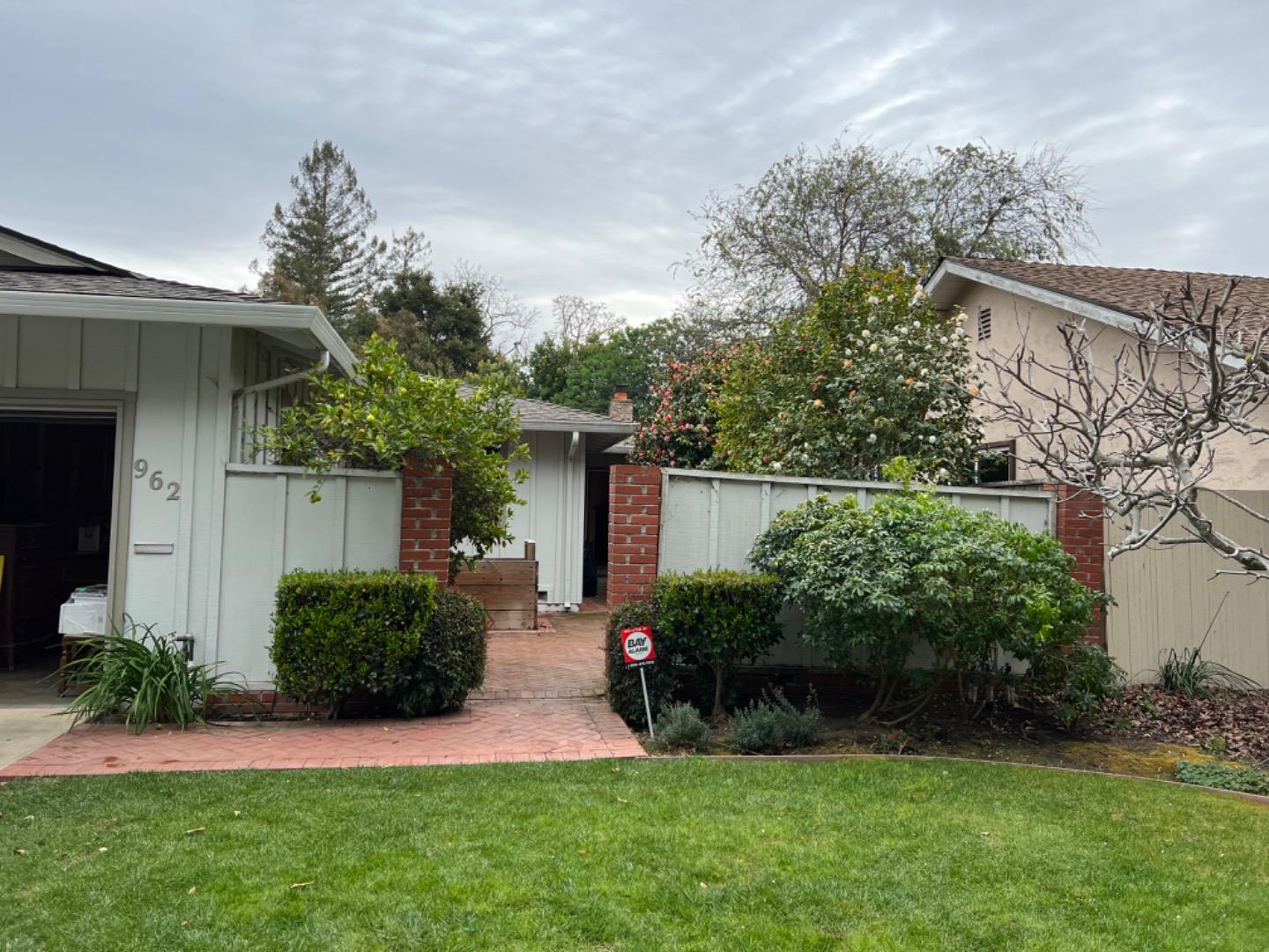 962 Addison Avenue Palo Alto, CA 94301 - Photo 1 of 1 front view of a house with a yard