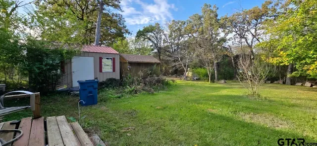 a backyard of a house with lots of green space