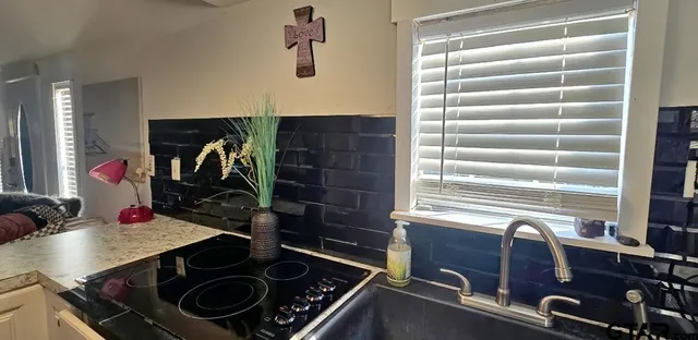 a kitchen with a stove and a sink