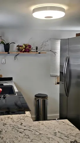 a bedroom with a bed and cabinets