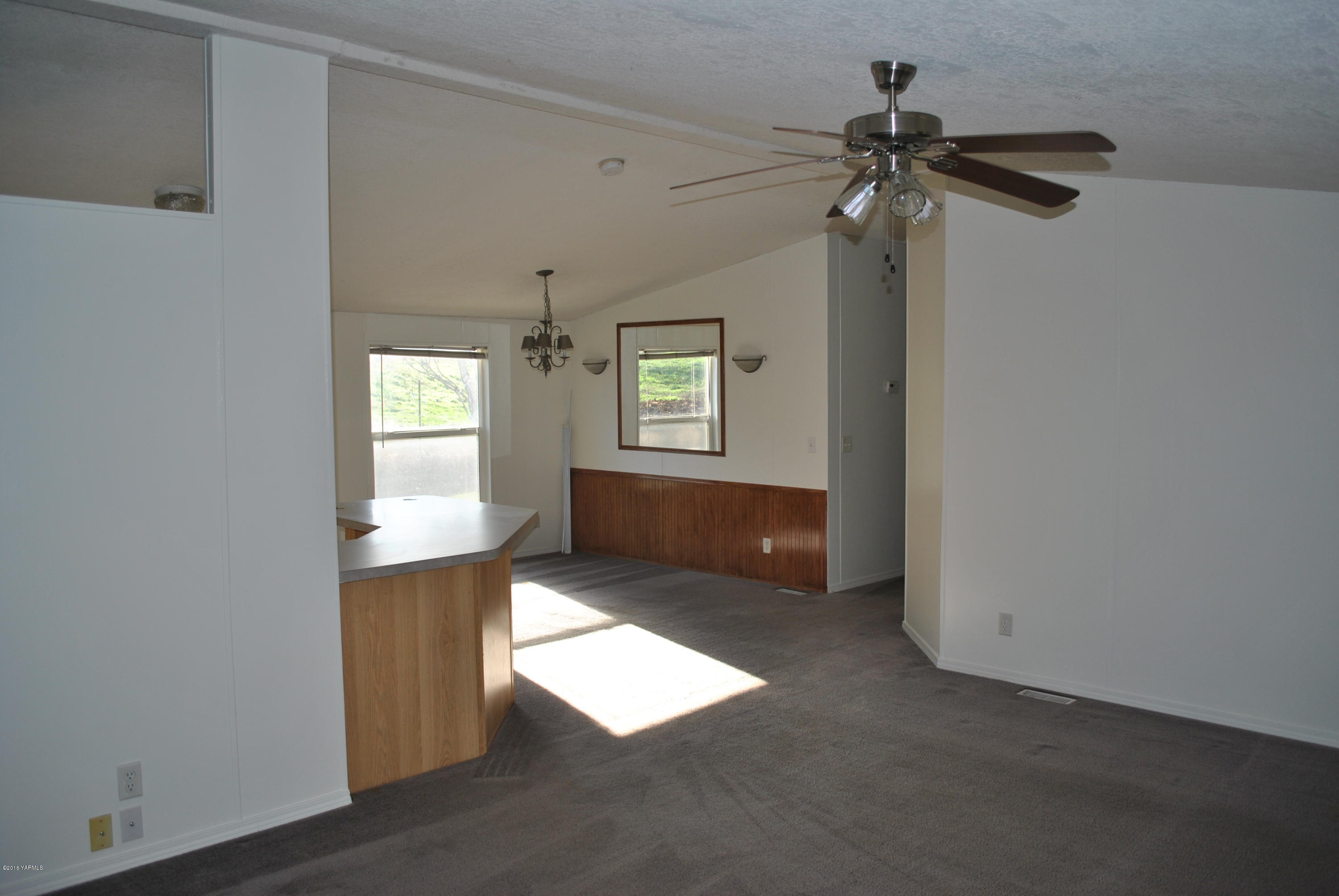 1153 Tear Road Grandview, WA 98930 - Photo 3 of 6 an empty room with windows and entrance