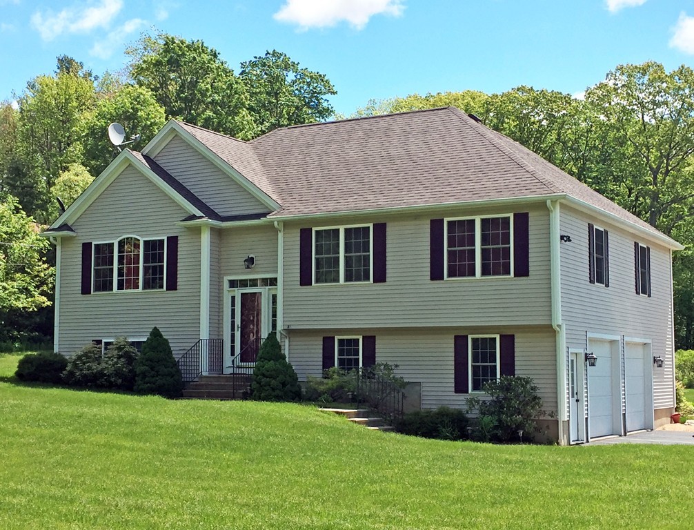 185 Burbank Road Sutton, MA 01590 - Photo 1 of 30 a house view with a garden space