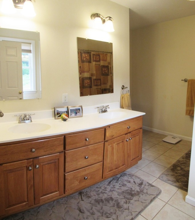 185 Burbank Road Sutton, MA 01590 - Photo 11 of 30 a bathroom with a sink vanity and mirror