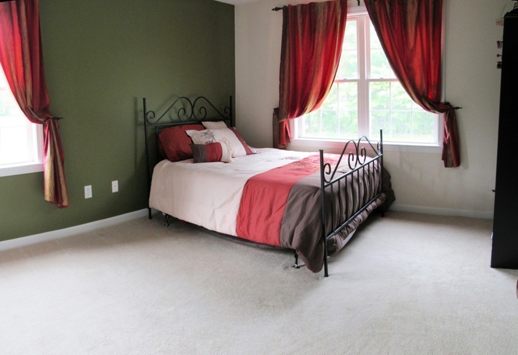 185 Burbank Road Sutton, MA 01590 - Photo 14 of 30 a bedroom with a bed and a window