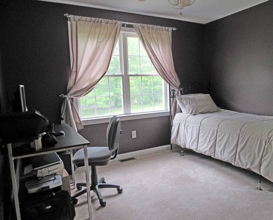 185 Burbank Road Sutton, MA 01590 - Photo 15 of 30 a bedroom with a bed and windows