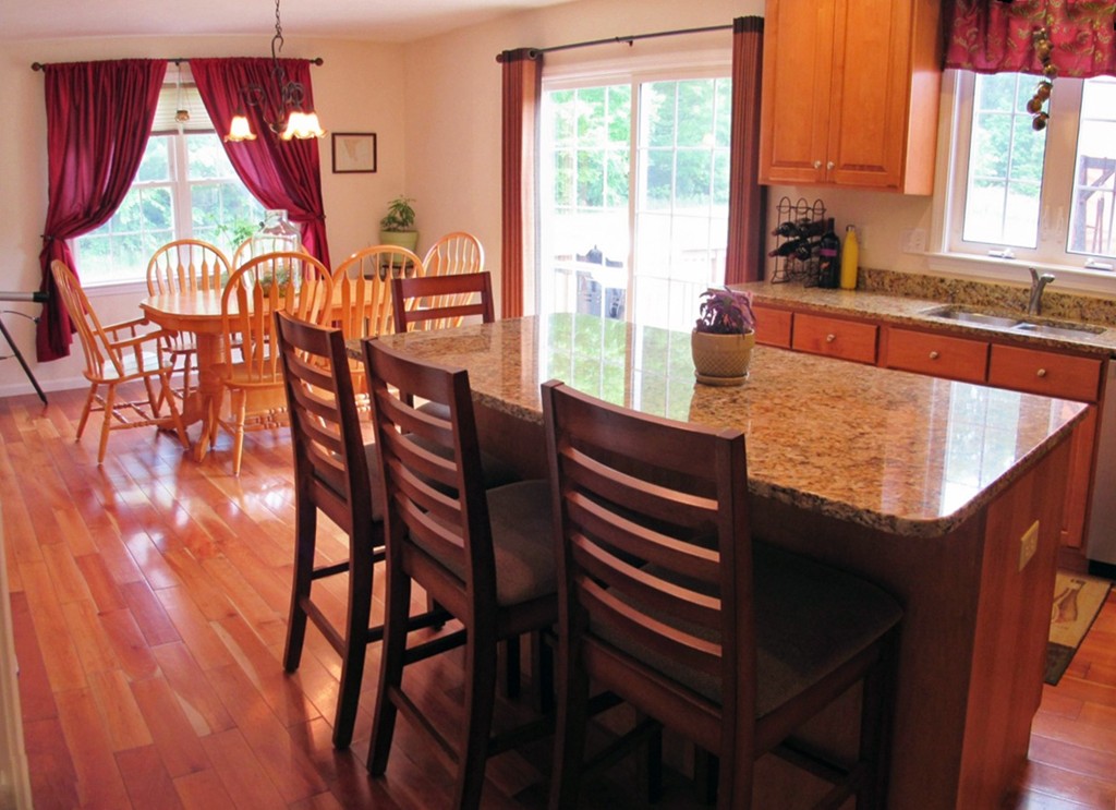 185 Burbank Road Sutton, MA 01590 - Photo 6 of 30 a view of a dining room with furniture window and wooden floor