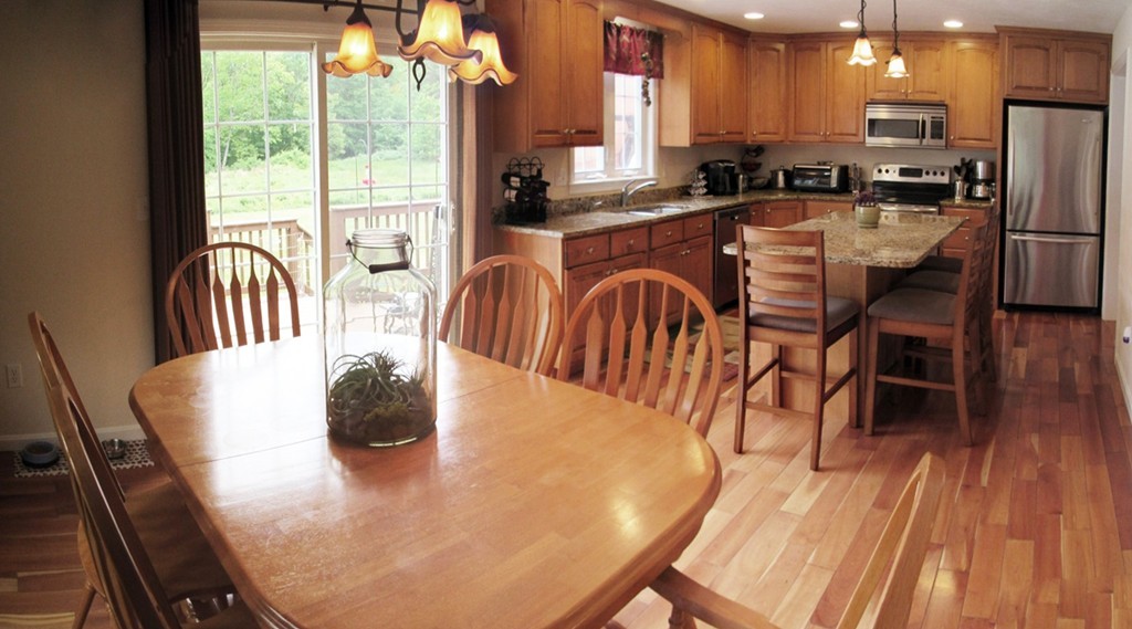 185 Burbank Road Sutton, MA 01590 - Photo 7 of 30 a dining room with furniture a large window and wooden floor