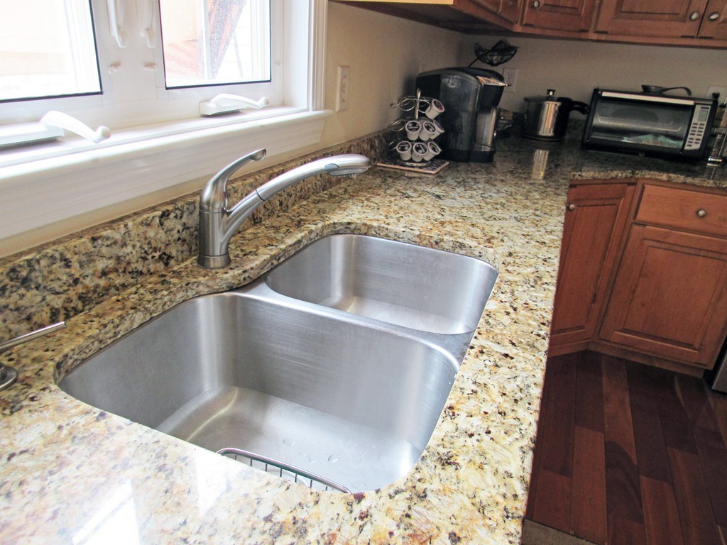 185 Burbank Road Sutton, MA 01590 - Photo 8 of 30 a kitchen with a sink and a stove