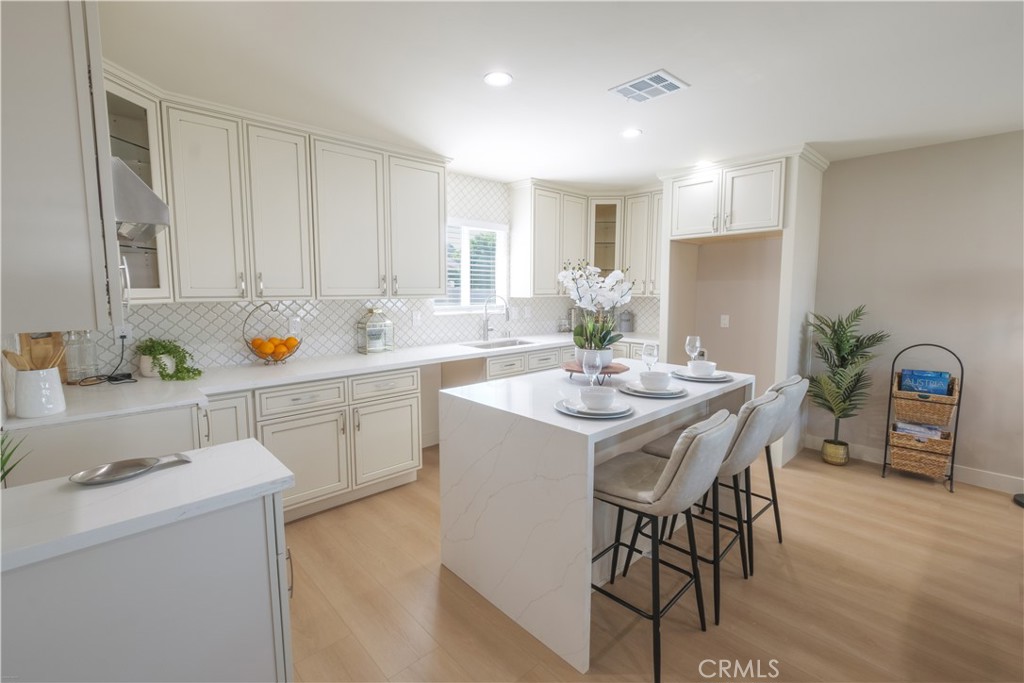 223 South Aprilia Avenue Compton, CA 90220 - Photo 7 of 46 a view of dining table chairs and microwave