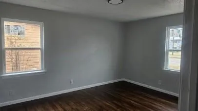a kitchen with wooden cabinets a sink and a stove