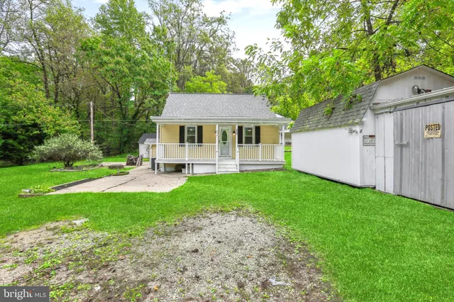 a front view of a house with yard