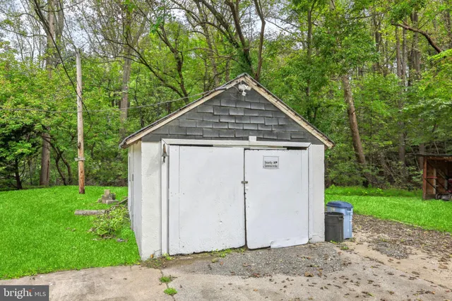 a view of a small house with a yard