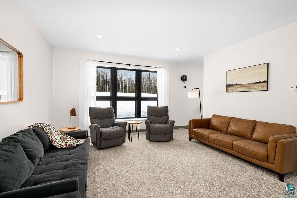 1491 Wildwood Road Duluth, MN 55804 - Photo 17 of 38 Carpeted living area featuring recessed lighting