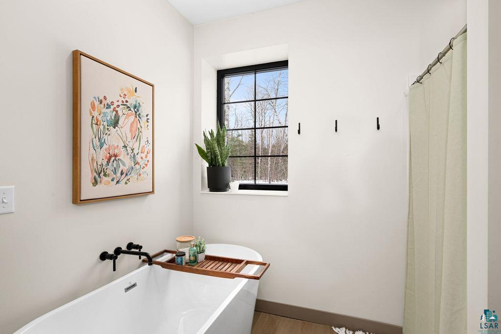 1491 Wildwood Road Duluth, MN 55804 - Photo 22 of 38 Full master bathroom featuring a soaking tub & shower.
