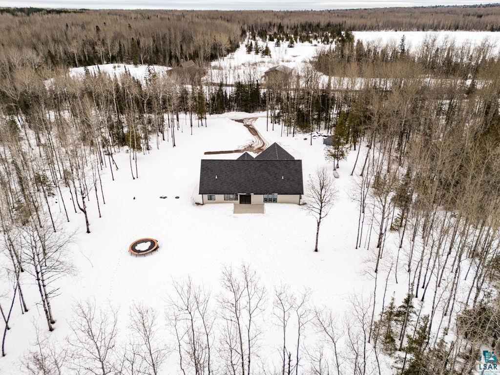 1491 Wildwood Road Duluth, MN 55804 - Photo 5 of 38 Snowy aerial view featuring a wooded view