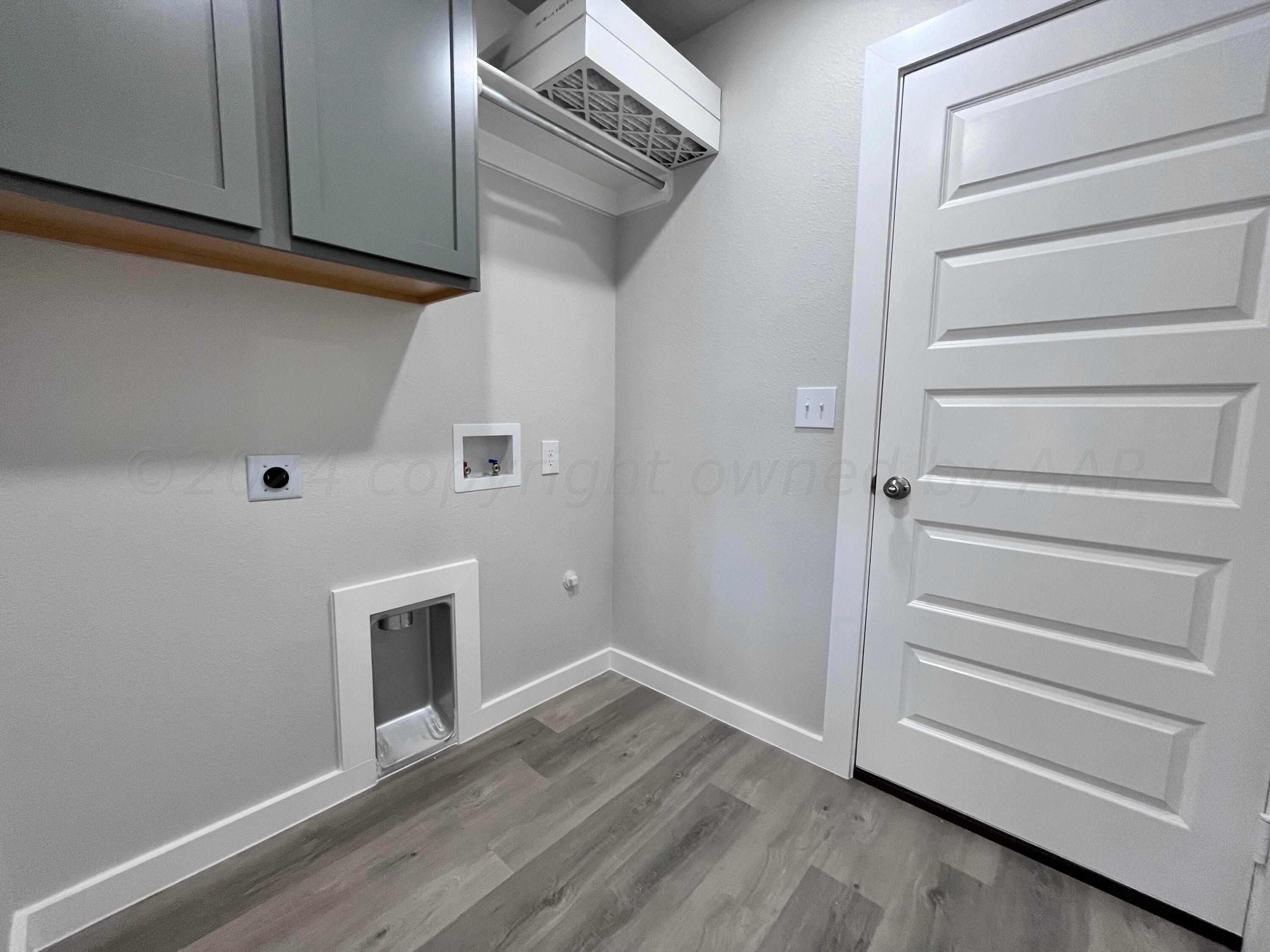 1605 Moon River Road Amarillo, TX 79118 - Photo 17 of 17 a view of an empty room with wooden floor and entryway