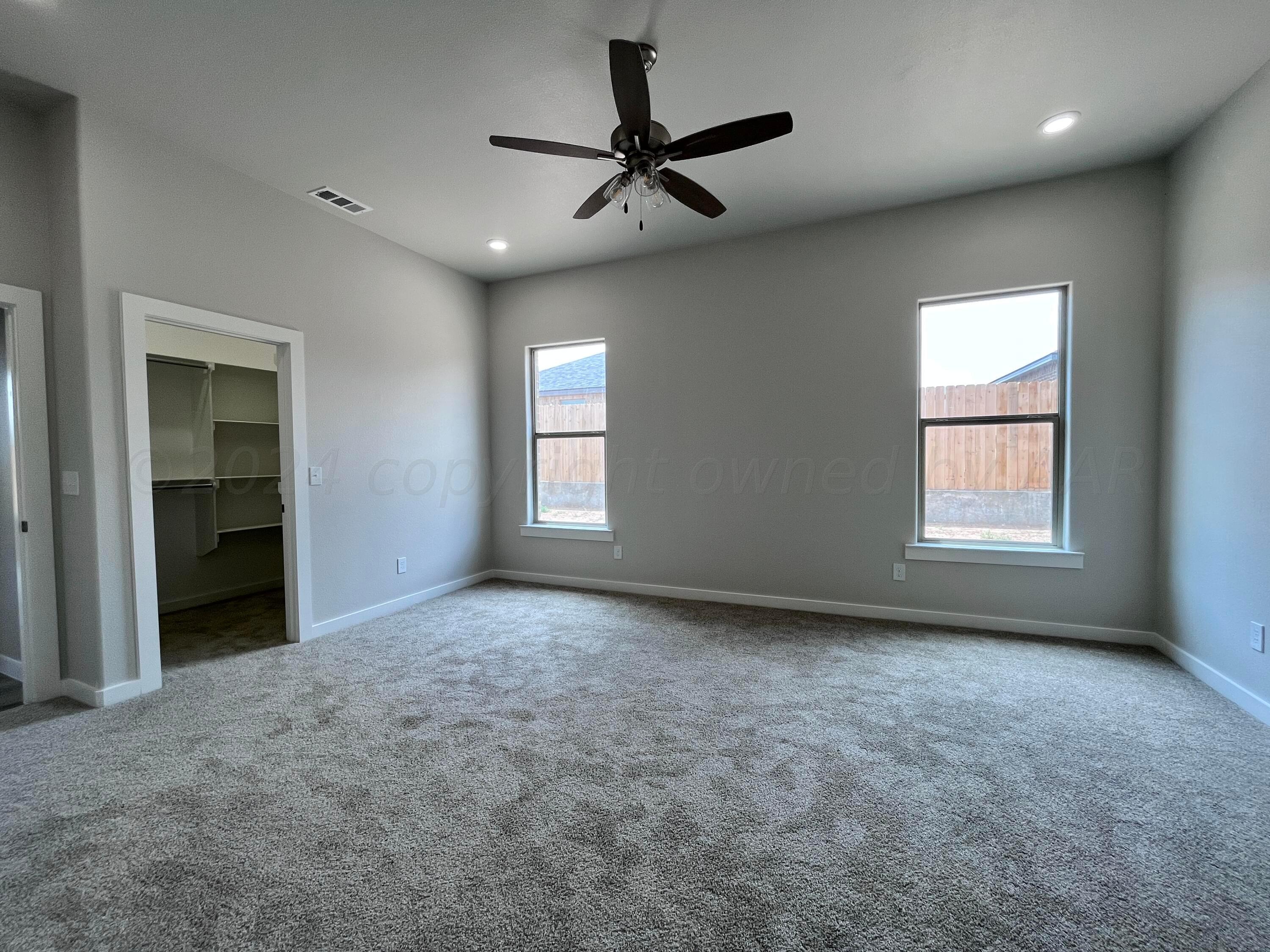 1605 Moon River Road Amarillo, TX 79118 - Photo 9 of 17 a view of a livingroom with a ceiling fan and window