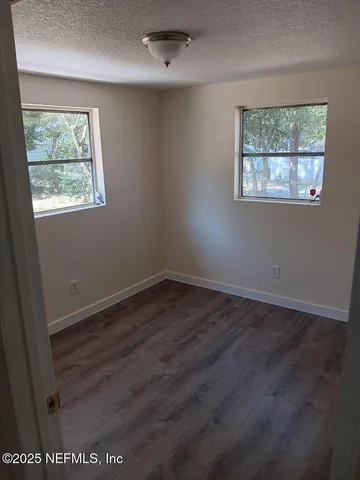 a kitchen with stainless steel appliances granite countertop a sink a stove and cabinets