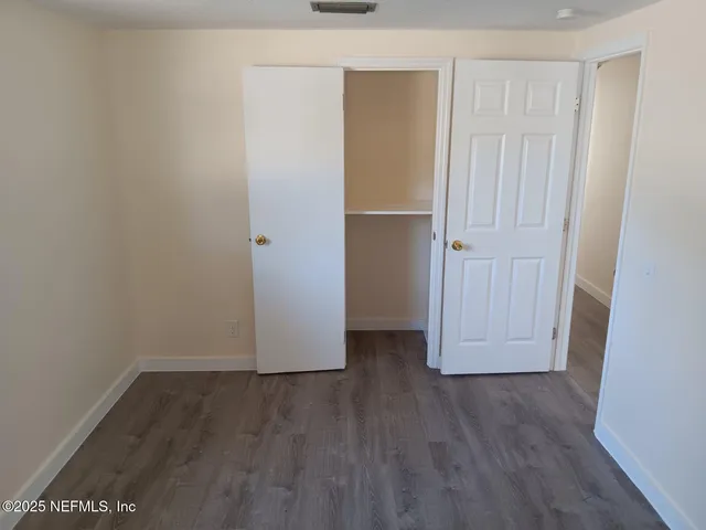 a white toilet sitting next to a bath tub