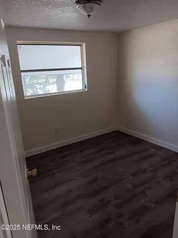 a view of storage and utility room with cabinets