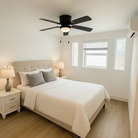 a bedroom with bed and window