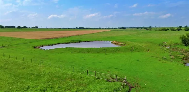 a view of a golf course with a lake