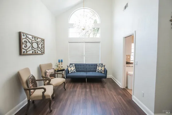 a view of a hallway with seating area
