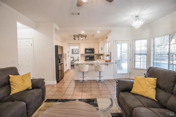 a living room with furniture and a large window