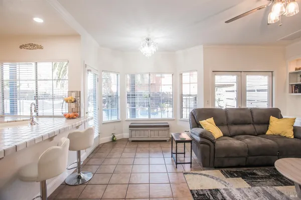 a living room with fireplace furniture and a flat screen tv
