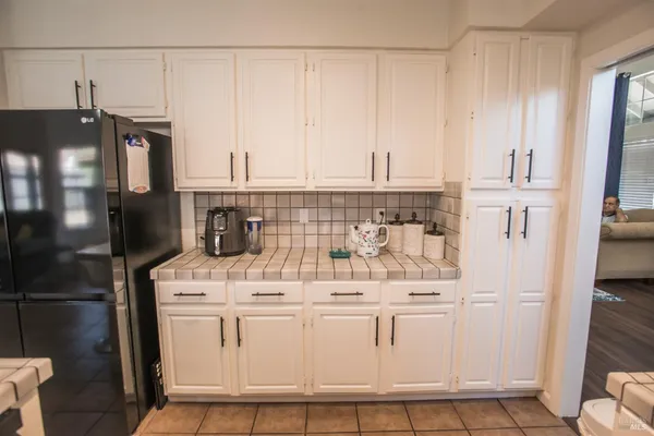 a view of a workspace with furniture and wooden floor