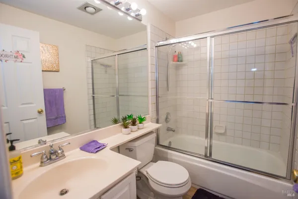 a bed room with a bed and a chandelier