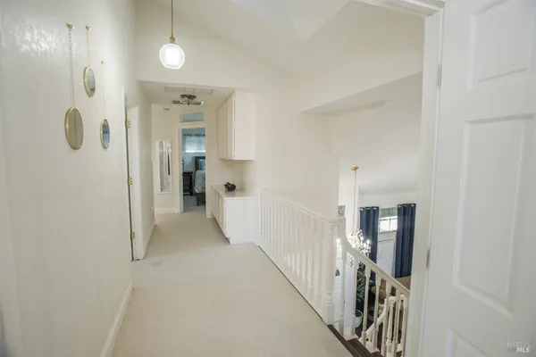 a spacious bathroom with a tub sink and mirror