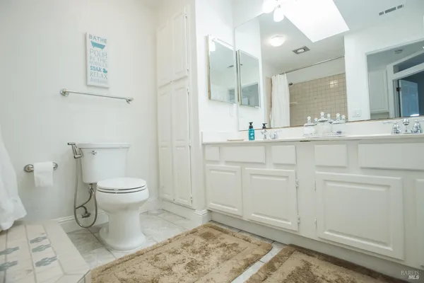 a view of a balcony with wooden floor