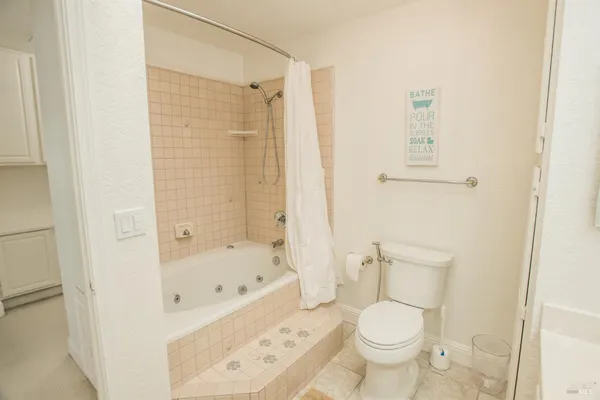 a view of a balcony with wooden floor