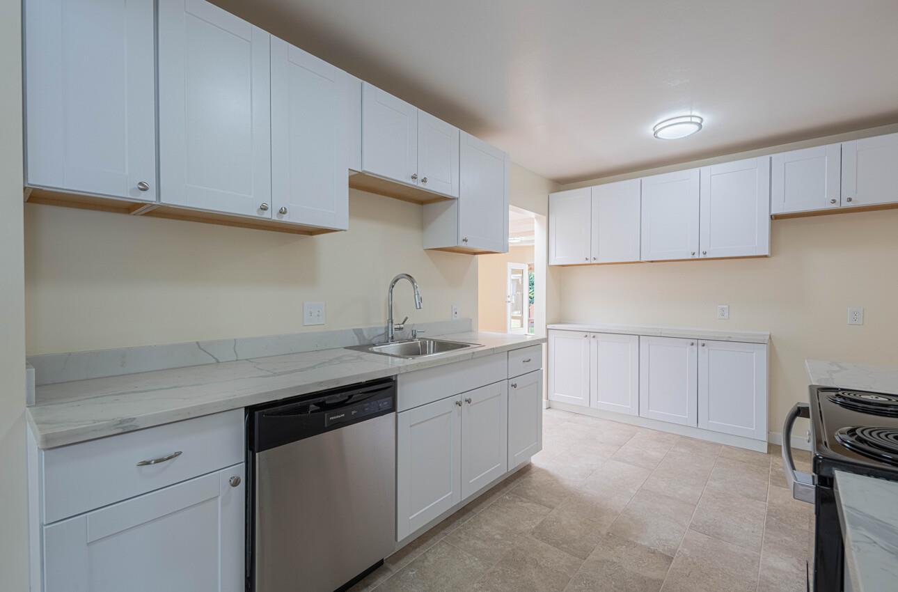 1221 Parkside Street Salinas, CA 93906 - Photo 12 of 41 a kitchen with a sink stove and cabinets