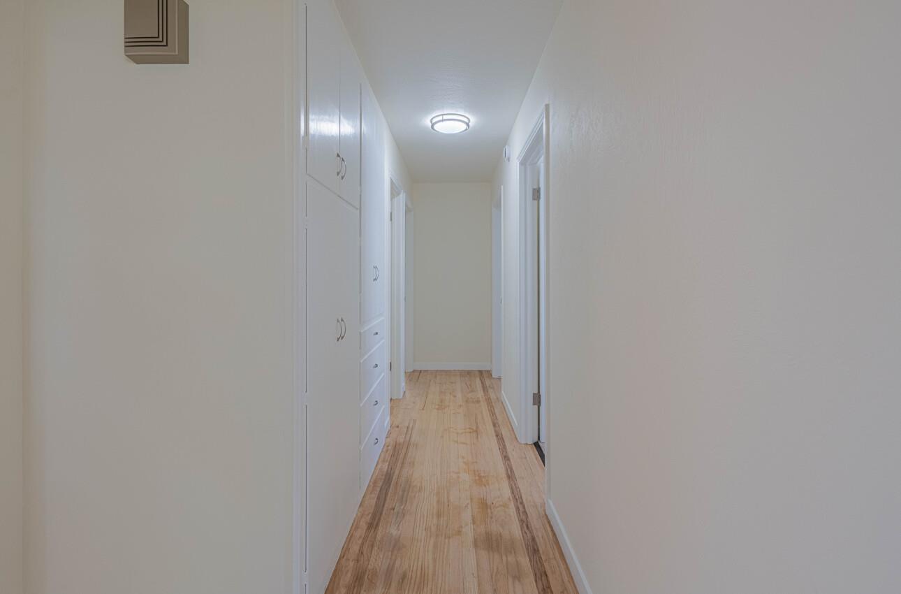 1221 Parkside Street Salinas, CA 93906 - Photo 20 of 41 a view of a hallway with wooden floor