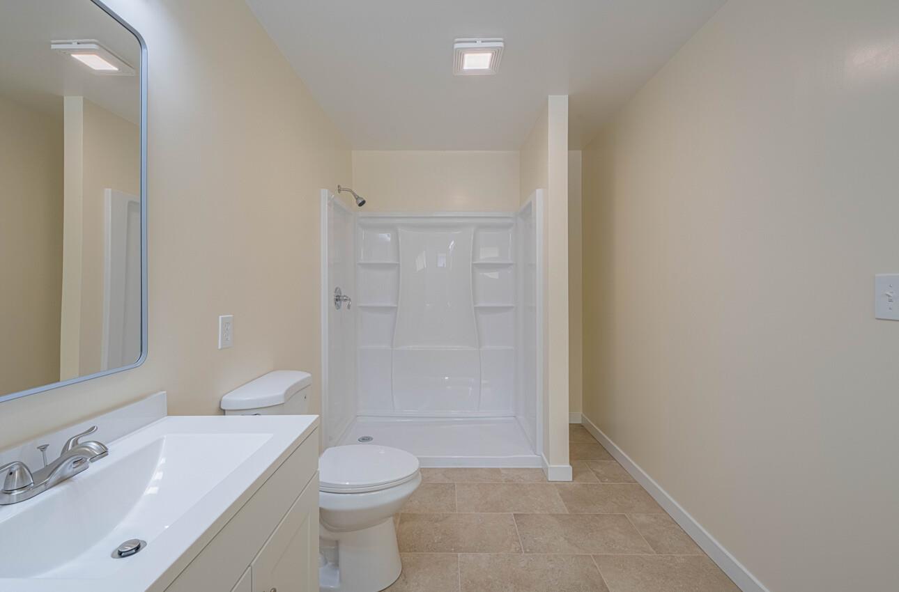 1221 Parkside Street Salinas, CA 93906 - Photo 26 of 41 a bathroom with a sink a toilet and shower