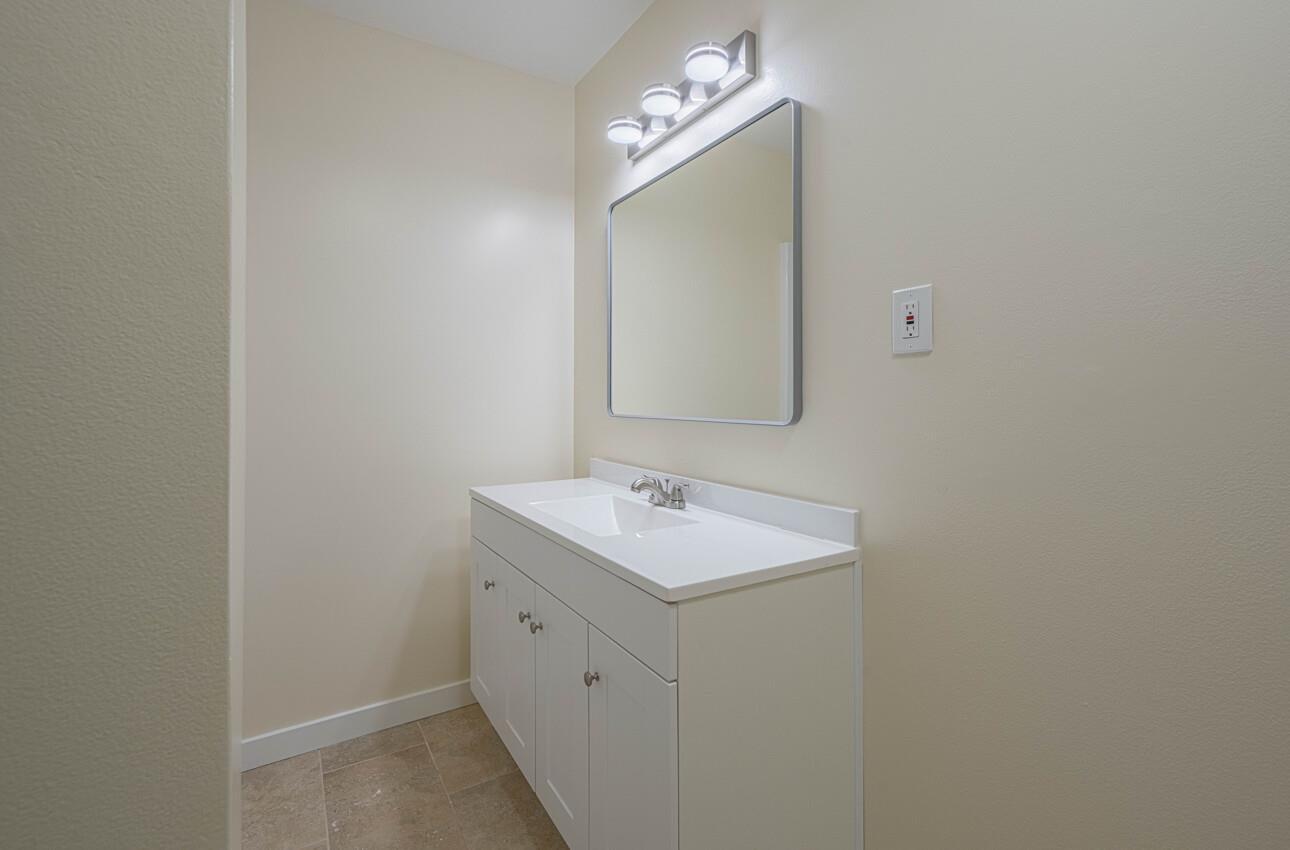 1221 Parkside Street Salinas, CA 93906 - Photo 33 of 41 a bathroom with a sink and a mirror