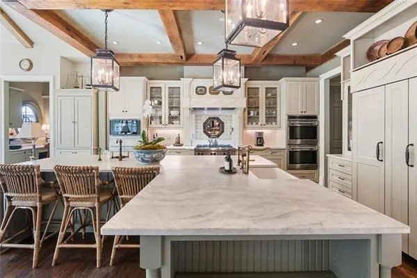 a living room with furniture a rug and a large window